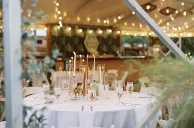 Ivy Hall outdoor wedding reception, string lights, elegant tables