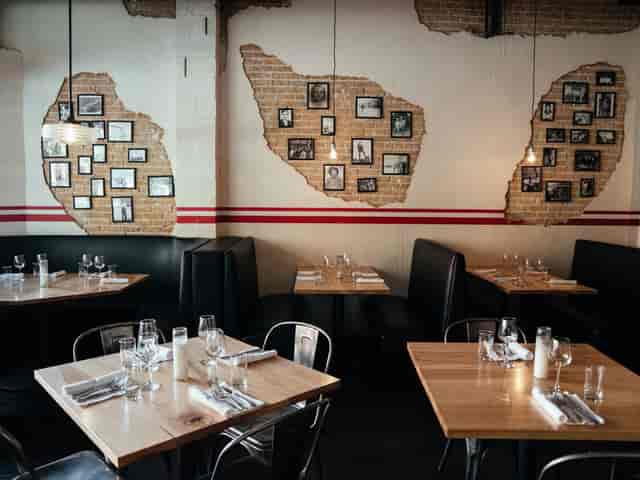 Rustic bistro event space, exposed brick, private dinner, cocktail reception.