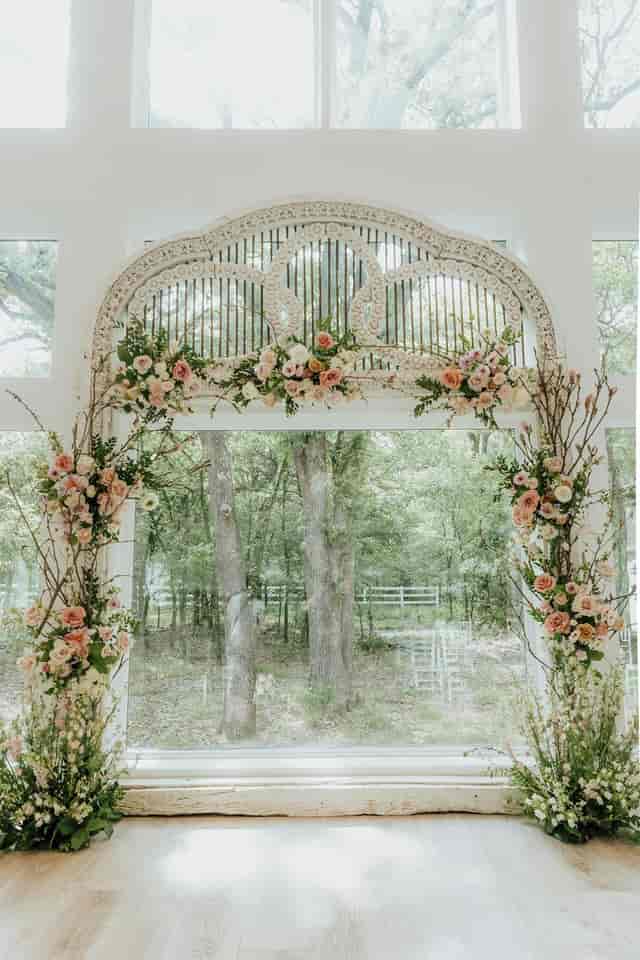 Romantic floral archway at French Farmhouse wedding venue.