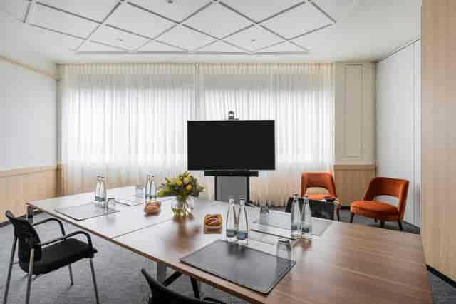 Geneva hybrid meeting boardroom, video conference, natural light