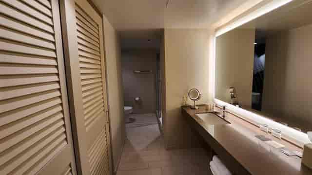 Austin hotel ballroom restroom, modern, accessible.