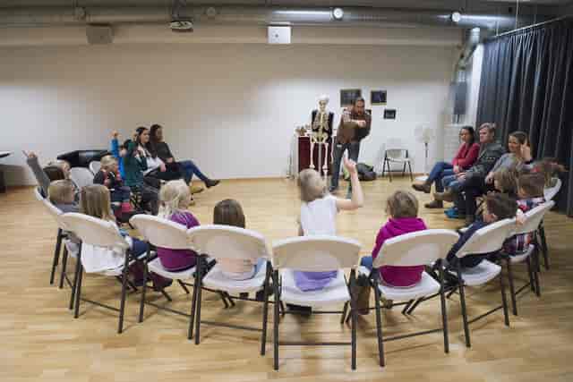 Kids' science museum workshop with skeleton, interactive event.