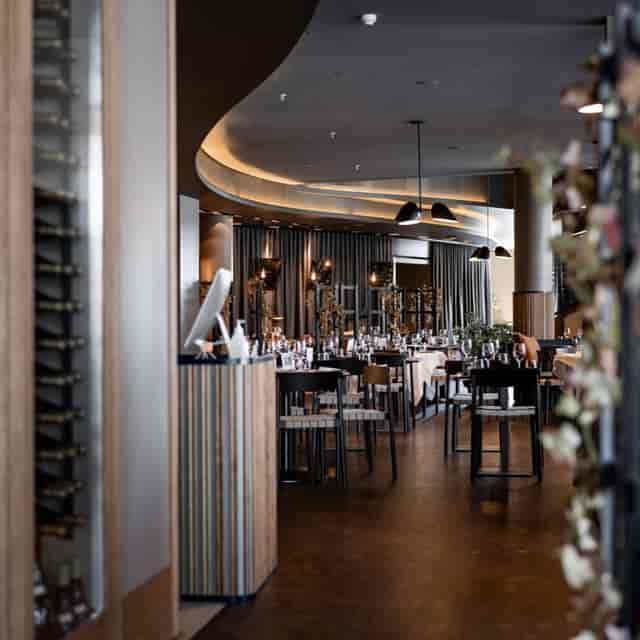 Modern Mezzanine event space, elegant drapery, corporate banquet.