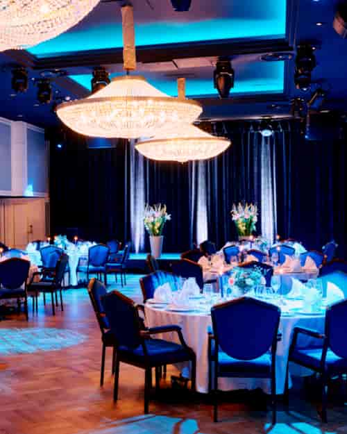 Elegant event space at Hotel Bristol with round tables for galas and corporate dinners.
