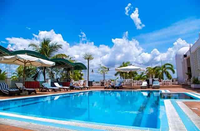 Zanzibar poolside conference, umbrella shade, event networking