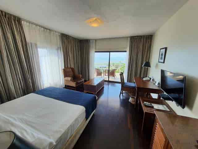 Luxury hotel suite, beach view, VIP executive retreat