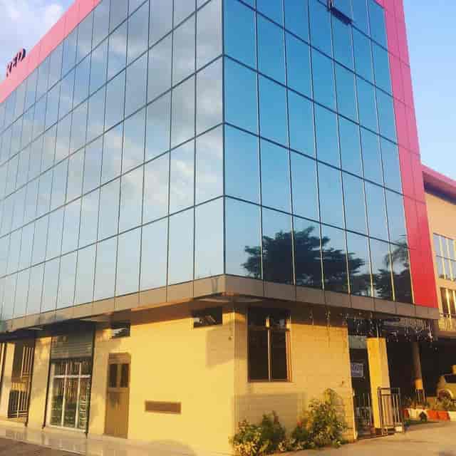 Ukumbi Sea Breeze Hall venue, modern glass, red accents, product launch, conference