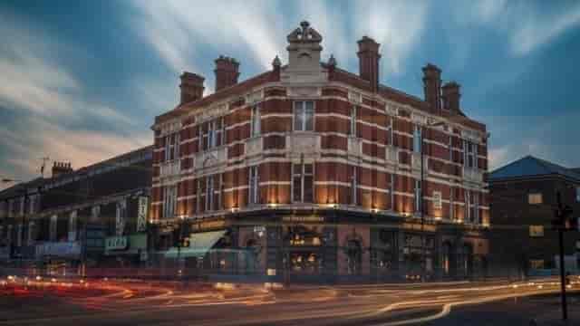 Historic urban pub corner, evening event venue