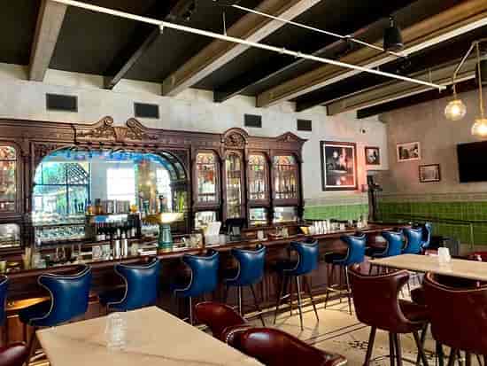 Eberly private dining: vintage bar, stained glass, cocktail party venue