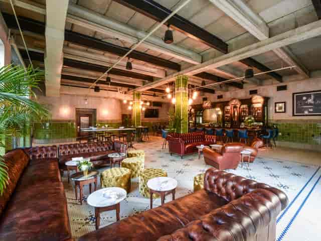 Eberly rooftop bar event, plush seating, cocktails