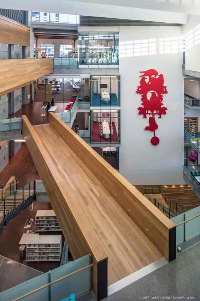 Austin library event space: slide, red clock, conference
