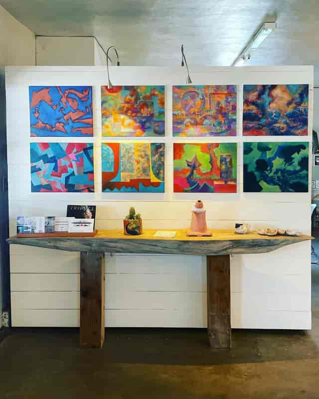 Abstract art gallery event space, rustic table