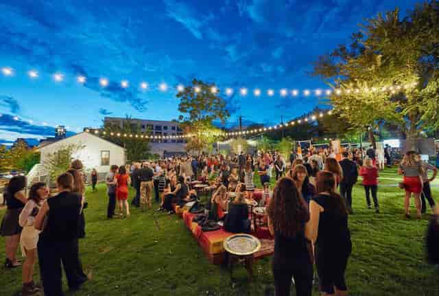 Outdoor networking reception, string lights, corporate event