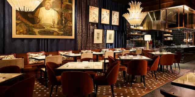 Bazaar José Andrés: Upscale corporate dinner, private celebration, opulent lighting, plush seating.