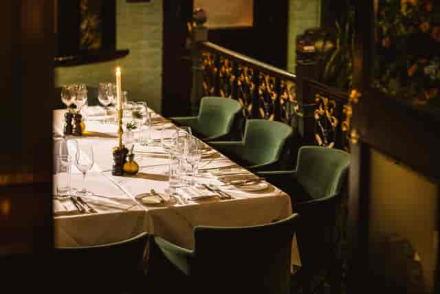 Elegantly set dining table in Courtyard Garden for intimate dinners and corporate events.