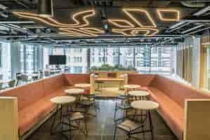 Modern meeting room with natural light, ideal for workshops and networking events.