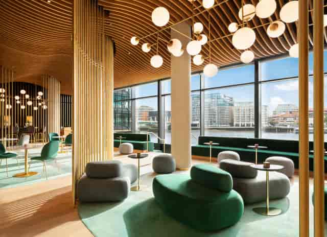 Modern meeting space with unique lighting at Hithe + Seek Bar & Kitchen, ideal for networking.