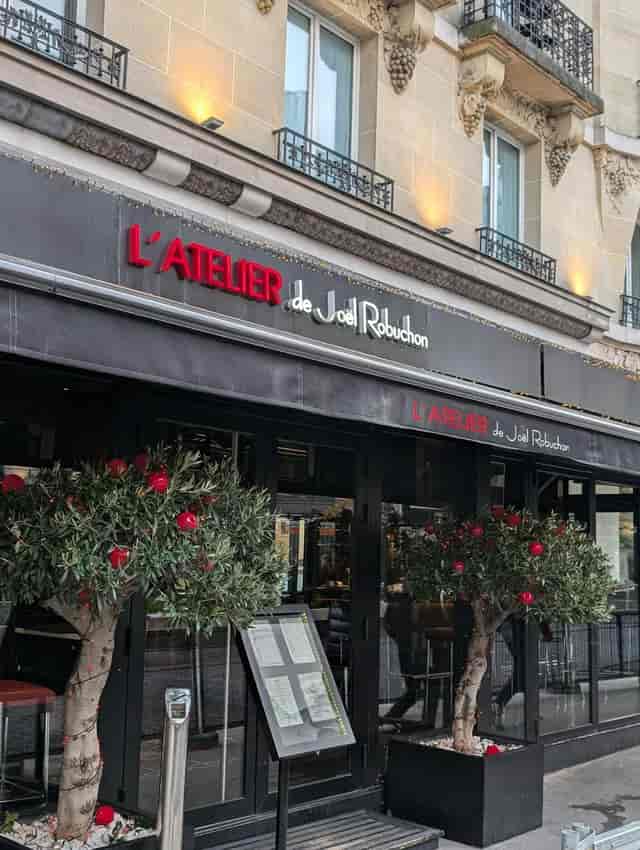Robuchon event: elegant restaurant signage, greenery, corporate dinner