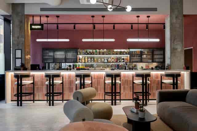 Modern bar area in Qube Elephant Lounge, ideal for networking events and casual meetings.