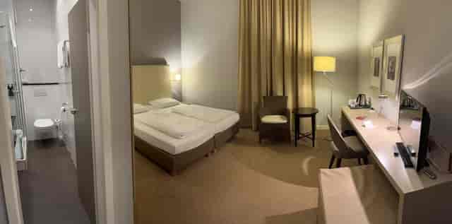 Ramada Munich Airport hotel room, desk, twin beds