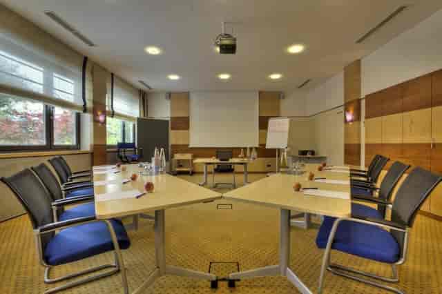 Boardroom meeting setup, natural light, training event