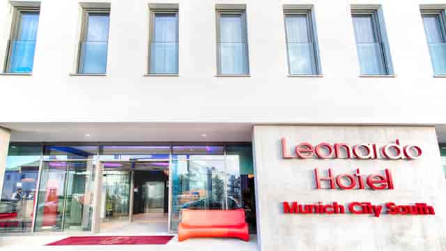 Munich hotel conference venue, modern, glass, corporate event