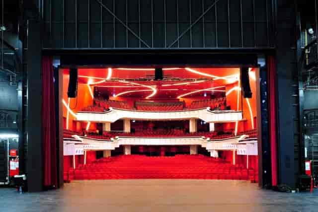 Deutsches Theater Munich stage, red accents, gala, product launch.