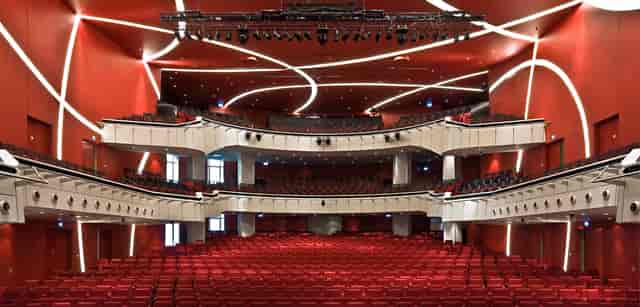 Munich theater stage, red seats, product launch event