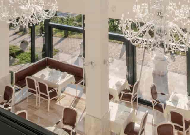 Elegant Caesar's Restaurant banquet event, chandeliers, natural light