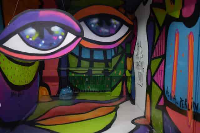Abstract art installation, eye motif, event backdrop, photo booth