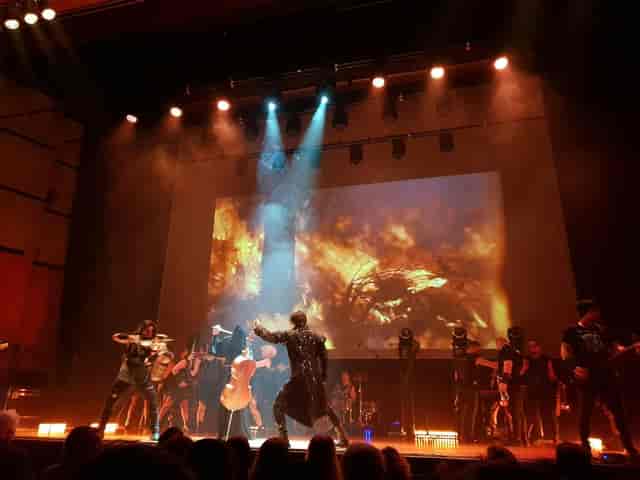 Stage production at Kongress am Park Augsburg with dramatic lighting and projection mapping.