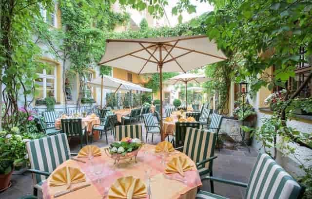 Maximilianstube outdoor breakout space at Romantik Hotel, ideal for professional event receptions.
