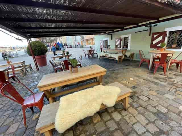 Rustic Stüberl at Historische Wurstkuchl for cozy team lunches and corporate networking events.