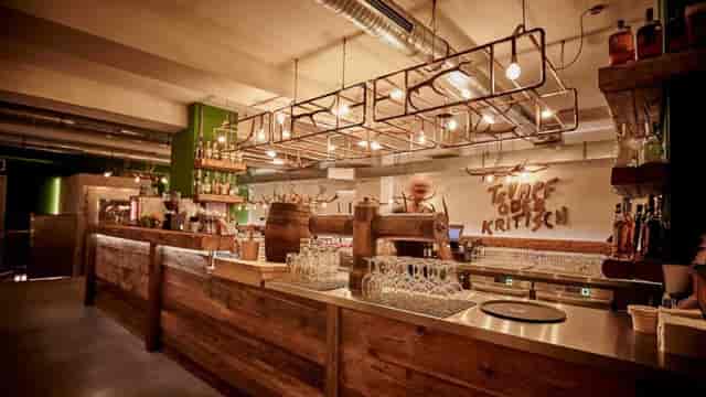 Rustic-industrial bar in Schwabing for networking receptions and brand activation events.