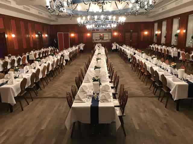 Isar Saal banquet hall with wood-paneled walls, ideal for large corporate events and gala dinners.