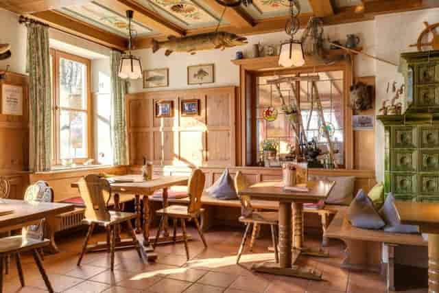 Rustic Seehof Ammersee conference room with bench seating for team-building events.