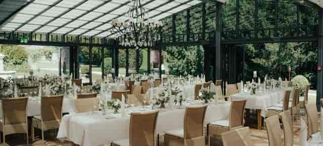 Glass conservatory function room in LA VILLA for corporate dinners and social events.