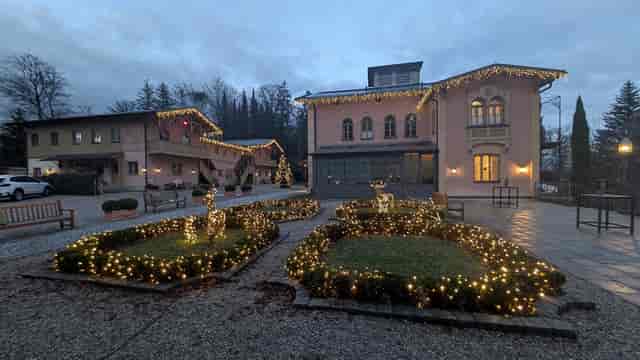 LA VILLA venue, festive exterior lighting, corporate holiday retreat, evening reception.