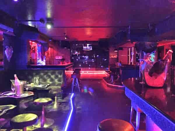 Palais Privat Club: upscale VIP after-party venue with high-energy, moody nightlife atmosphere.