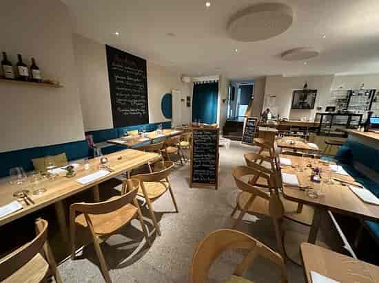 Minimalist cafe venue at Münchner Stadtmuseum for intimate corporate events and team dinners.