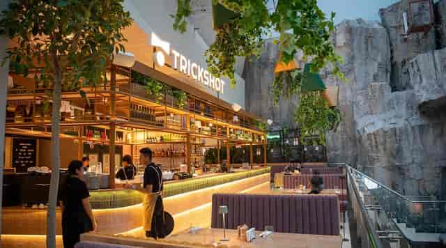 Biophilic food court lounge for corporate dinner and cocktail reception event venue.