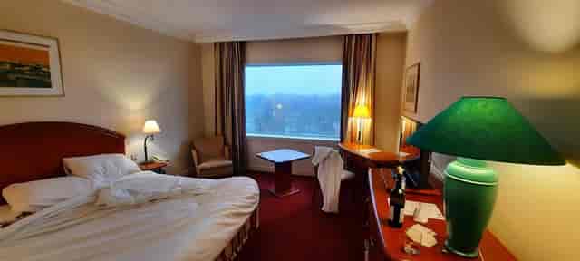 Unmade hotel room at Pullman Bucharest, professional housekeeping service for business events.