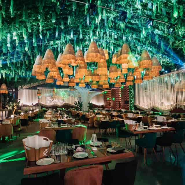 Maximalist lighting and greenery at Face Summer Bucharest for upscale galas and brand activations.
