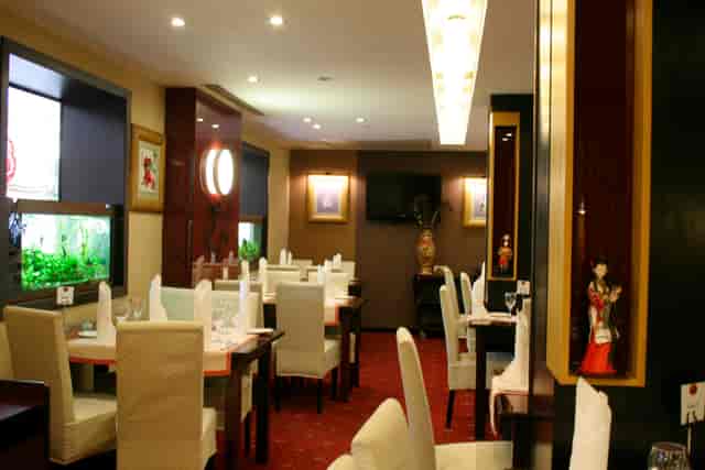 Private dining room at Hotel Minerva for corporate lunches and VIP events with AV display.