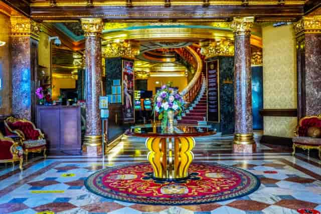 Gilded lobby at Upstairs Salon Palace Casino, perfect for VIP networking and corporate events.
