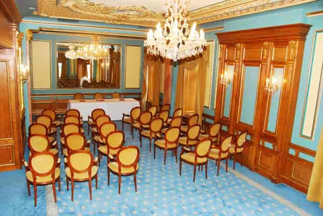 Marble Salon at Casa Capsa Hotel: opulent theater-style setup for executive board meetings.