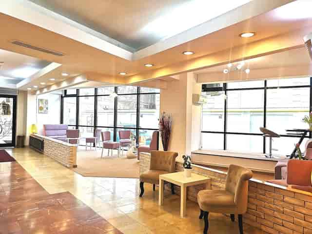 Atrium Hotel Bucharest conference room with tiered layout for event networking and registration.
