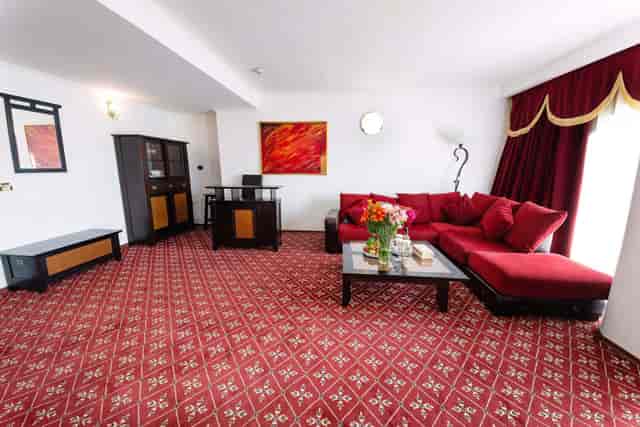 VIP hospitality suite at Phoenicia Hotel with lounge seating for private event breakouts.