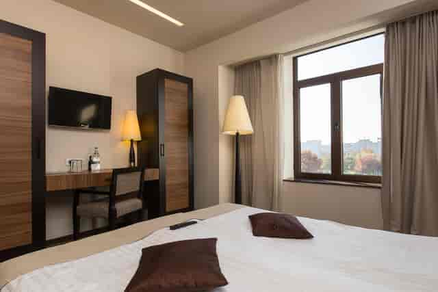 Europa Royale Bucharest hotel suite with workspace for business conferences and room blocks.