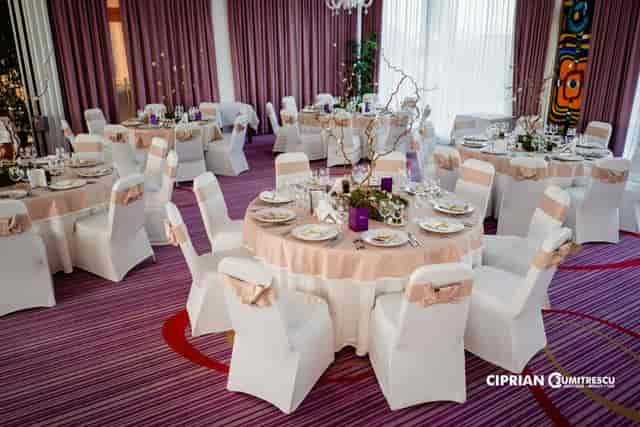 Panoramic Hall banquet setup with peach linens for wedding and corporate event hosting.